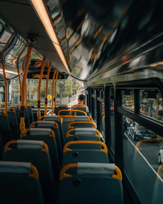 empty seats sitting in front of an open bus