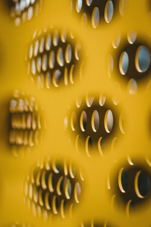 a wall of metal objects, like a number of holes