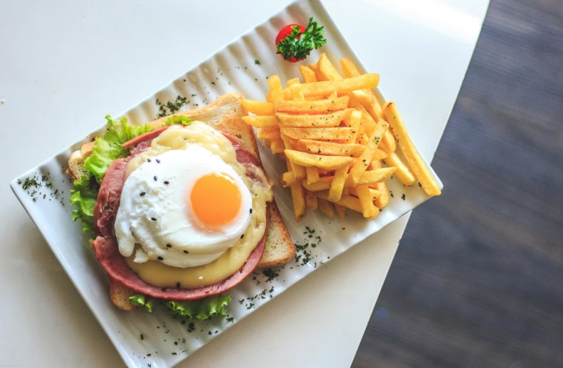 a hamburger and french fries on a plate