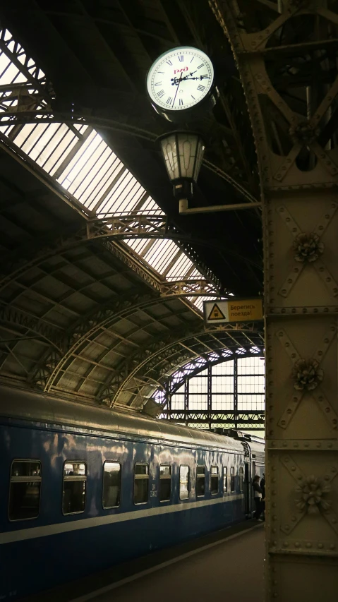 the interior of an old train station with a clock tower