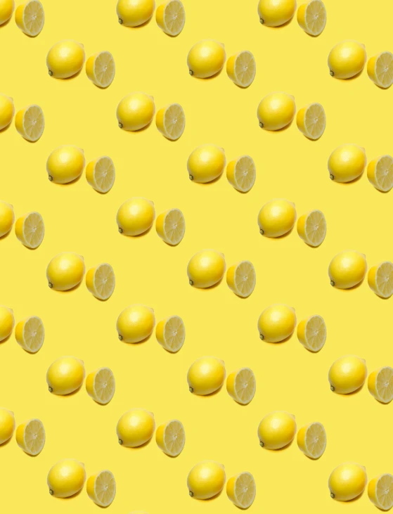 a pattern with lemons and slices on a yellow background