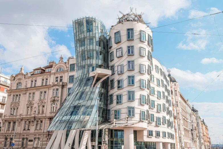 a modern building near another old apartment building