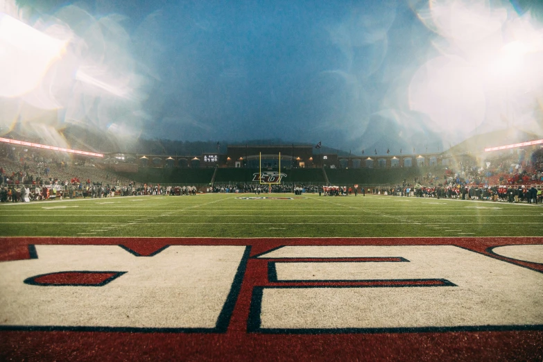 the letters eeb and b are located in front of an empty stadium