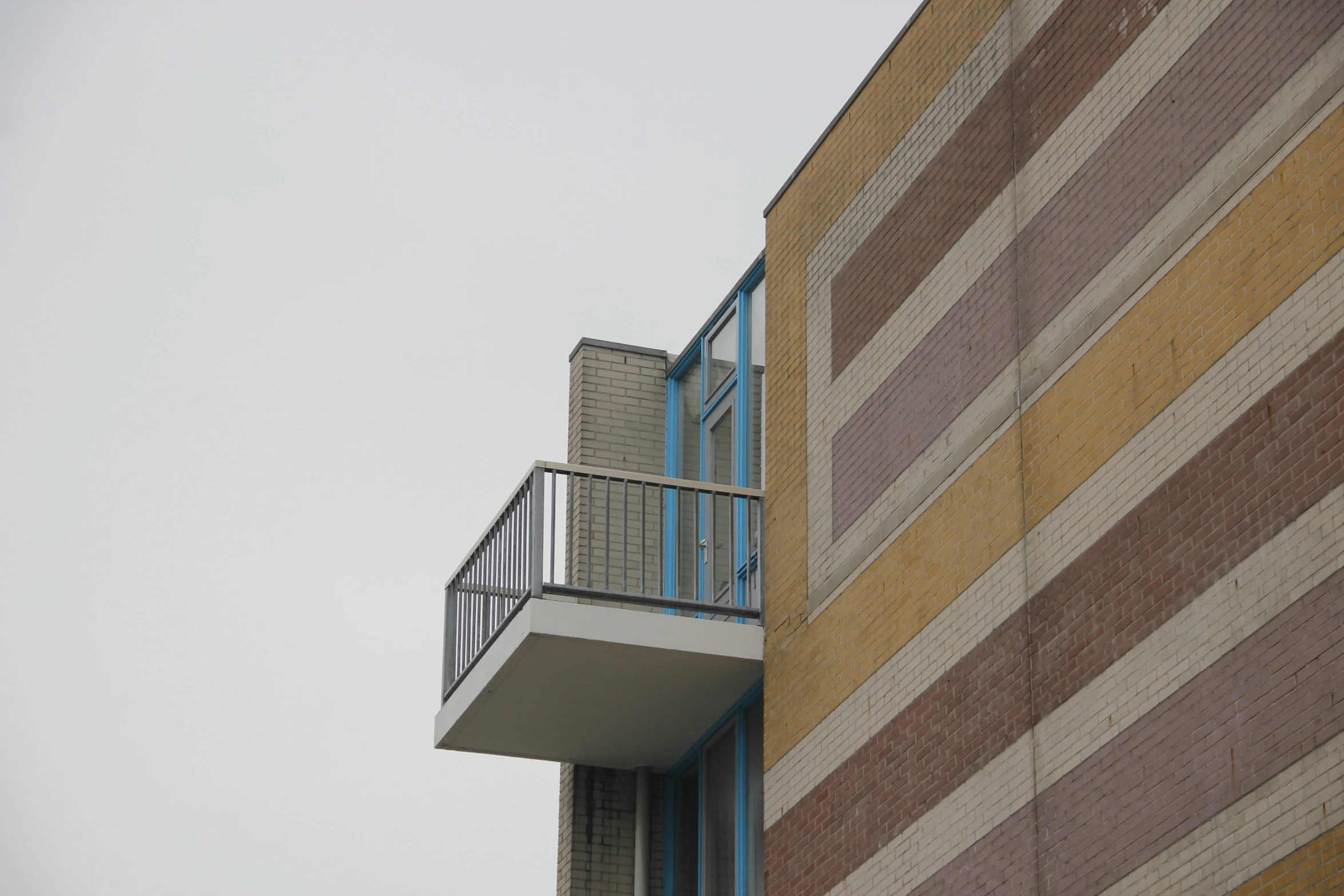 a building with a balcony and small balconies