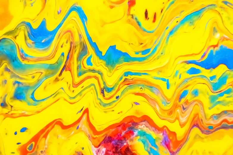 abstract swirled background of yellow and blue liquid