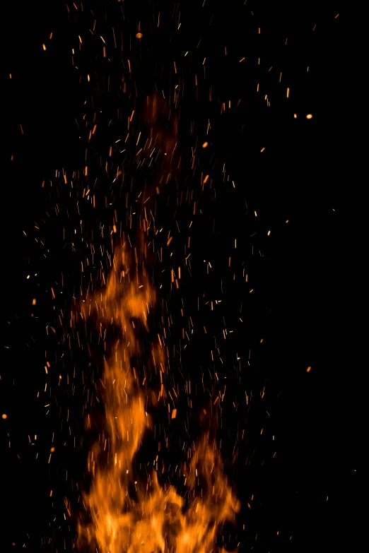 the yellow fire is burning against a black background