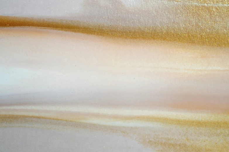 an abstract painting in neutral and gold colors