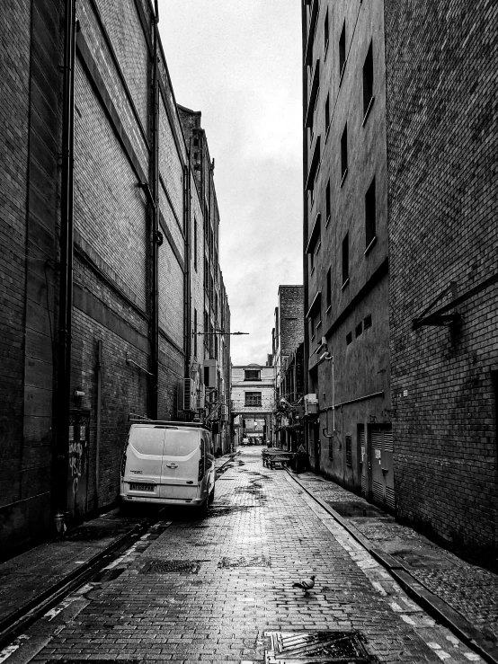 a car parked outside of some buildings on a street