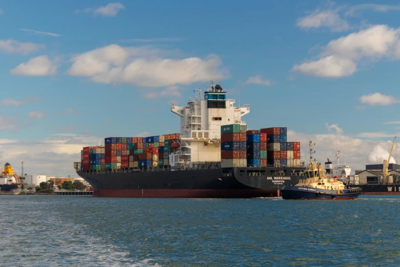 a large boat floating across the ocean next to a harbor