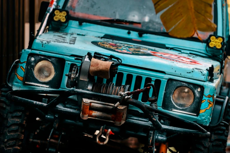 an old jeep with some odd things on the front