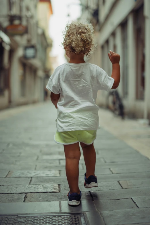 a  walking down a sidewalk