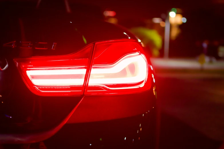 the tail light of a red car is shown