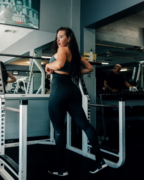 a woman is working out in a gym