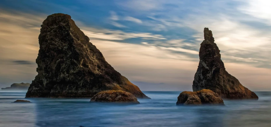 an image of an ocean scene with rocks in the water