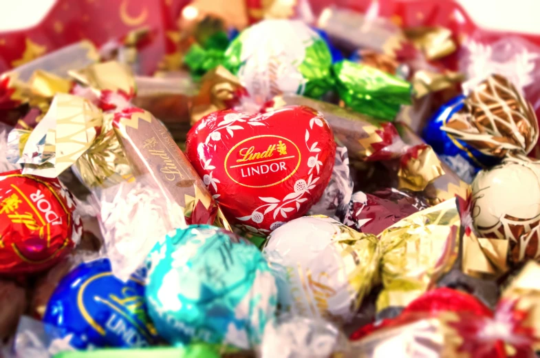 several assortment of chocolates with colorful wrappers