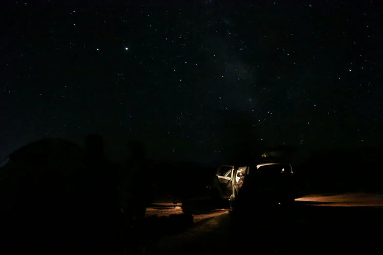 a vehicle parked on a street under some stars