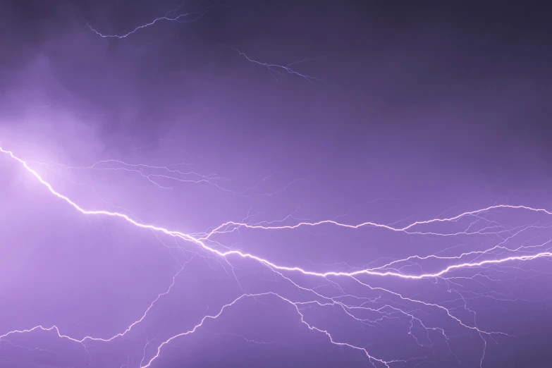 a number of lightnings flying in the sky