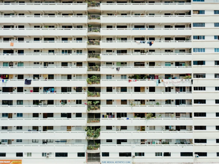 large white building that has balconies and windows