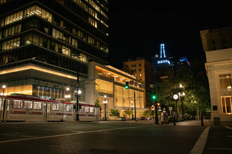 some street lights and a building at night