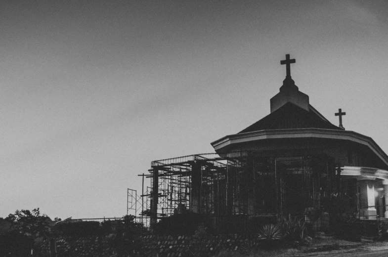 a church under construction with the roof painted