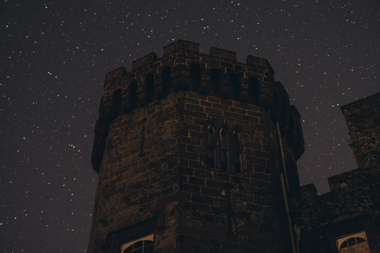 a castle with many windows and stars on the sky