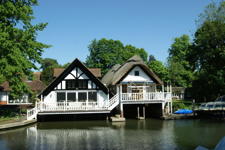 a row of cottages sitting next to the water