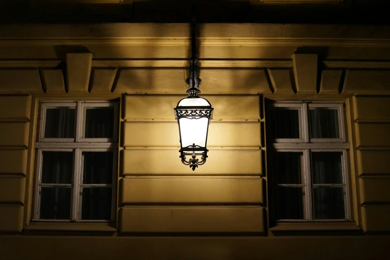 a light is hanging on the side of a building