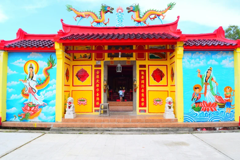 a brightly colored entrance to a temple building