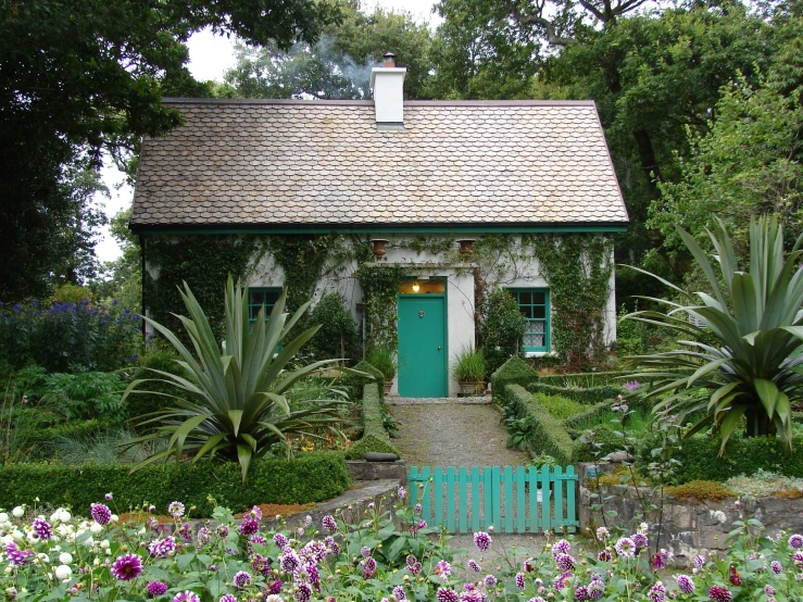 a green building with a light blue door