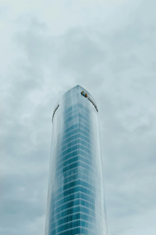 an airplane flying through the air next to a tall building