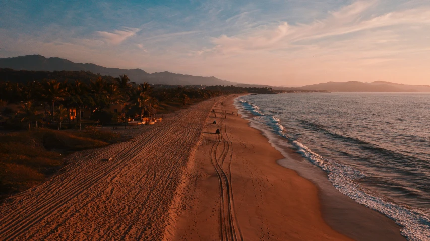 the shore line of a beach near the ocean