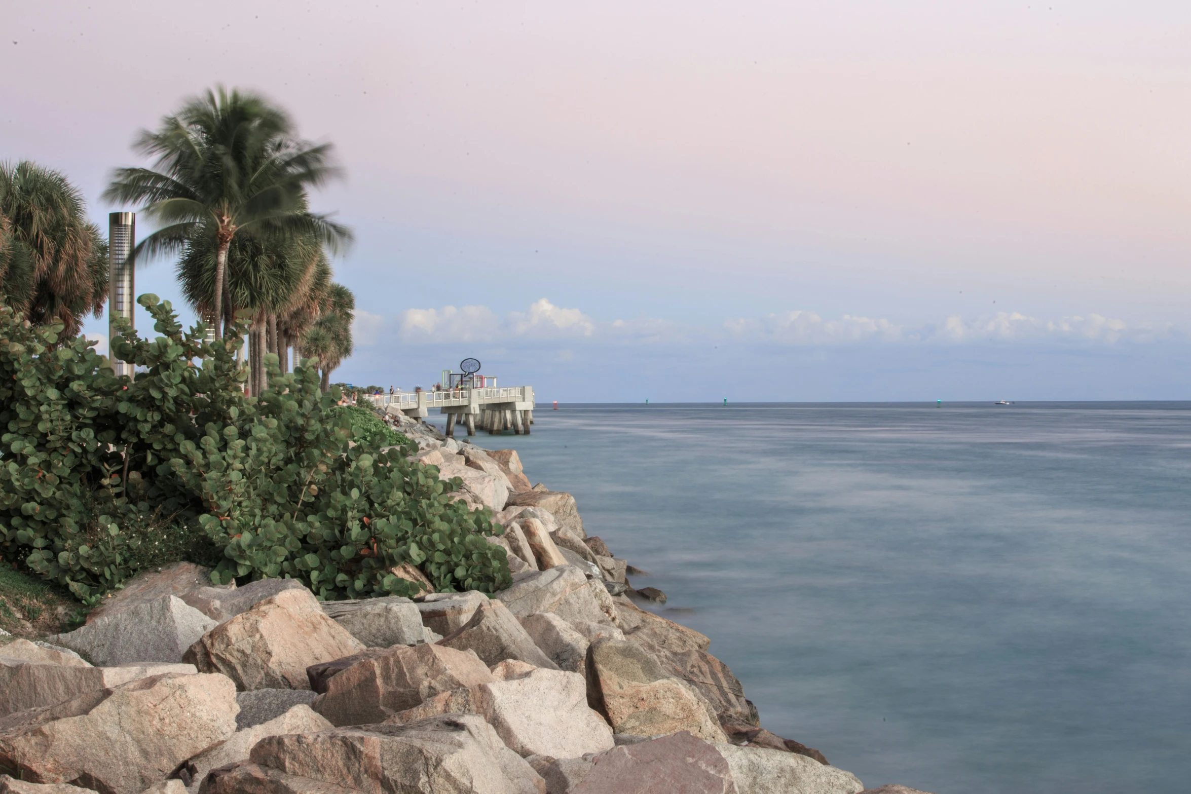 there is a long pier sitting in the water