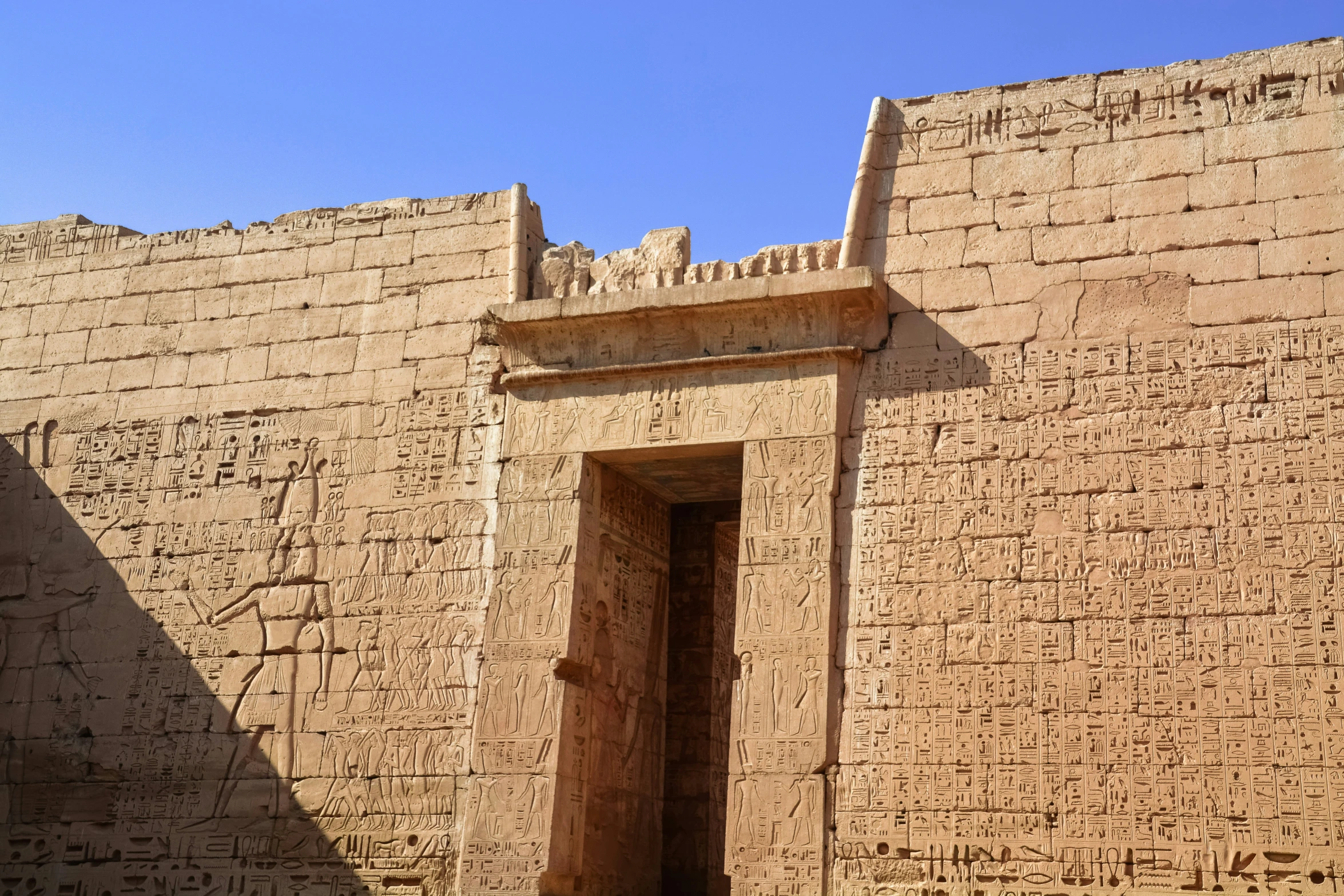 the doorway to the entrance is flanked by two archways