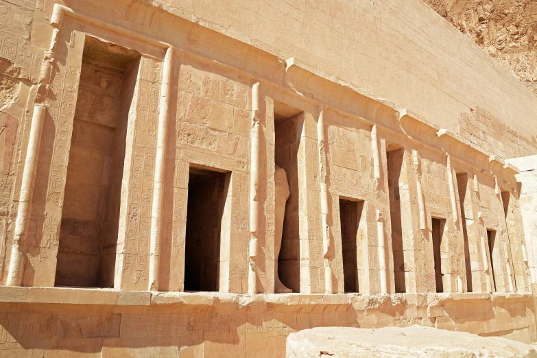 two stone pillars in front of a building