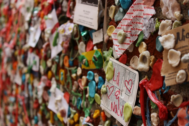 a colorful wall full of many ribbons and greetings