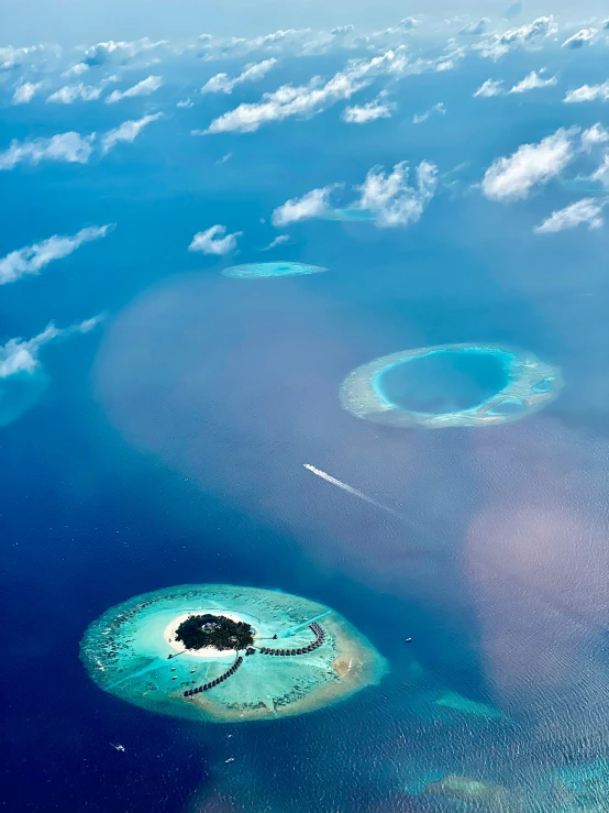 the islands are surrounded by clouds in the air