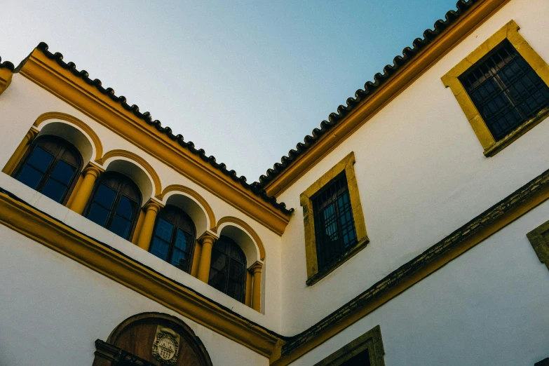 the view of a building from below a balcony