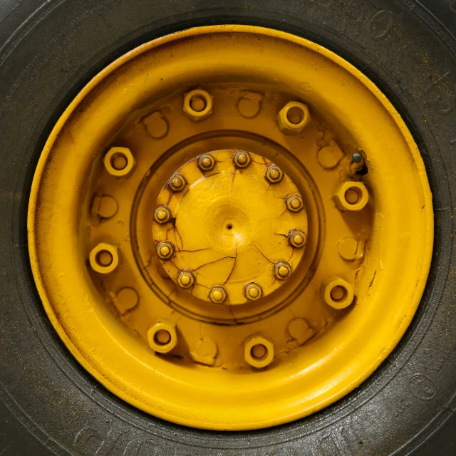 a close - up s of a metal wheel on the top of a tire