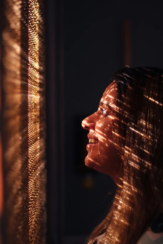 a woman looking into a mirror in the bathroom