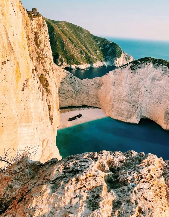 the top view of some mountains with a body of water