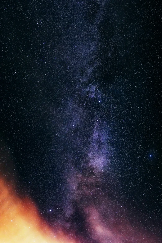 an airplane flies overhead in the night sky