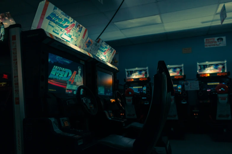 the machines are in an empty room with old arcade video games