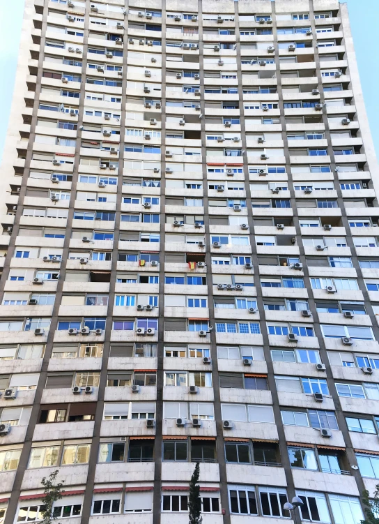 a large building with very high windows is seen against the sky