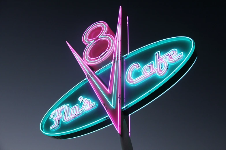 a neon sign on the side of a building that says eight six