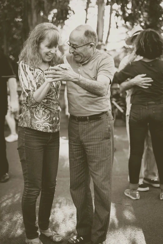 the man is standing next to his woman