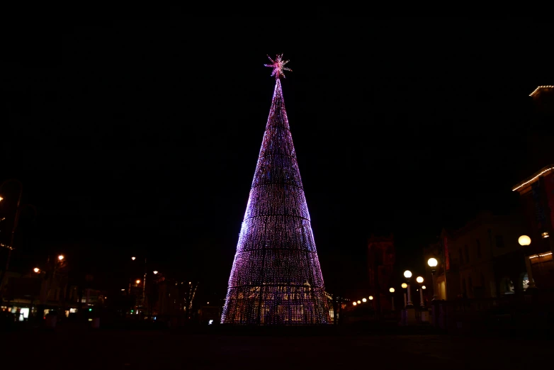 the lighted christmas tree is lit up with lights