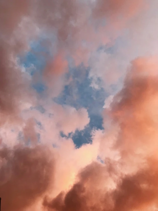 pink and blue sky with very fluffy clouds