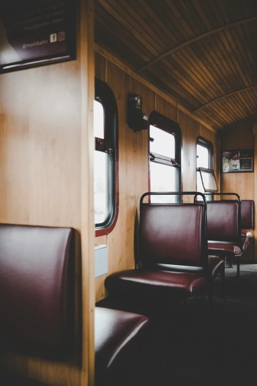 the inside of a passenger bus with seating