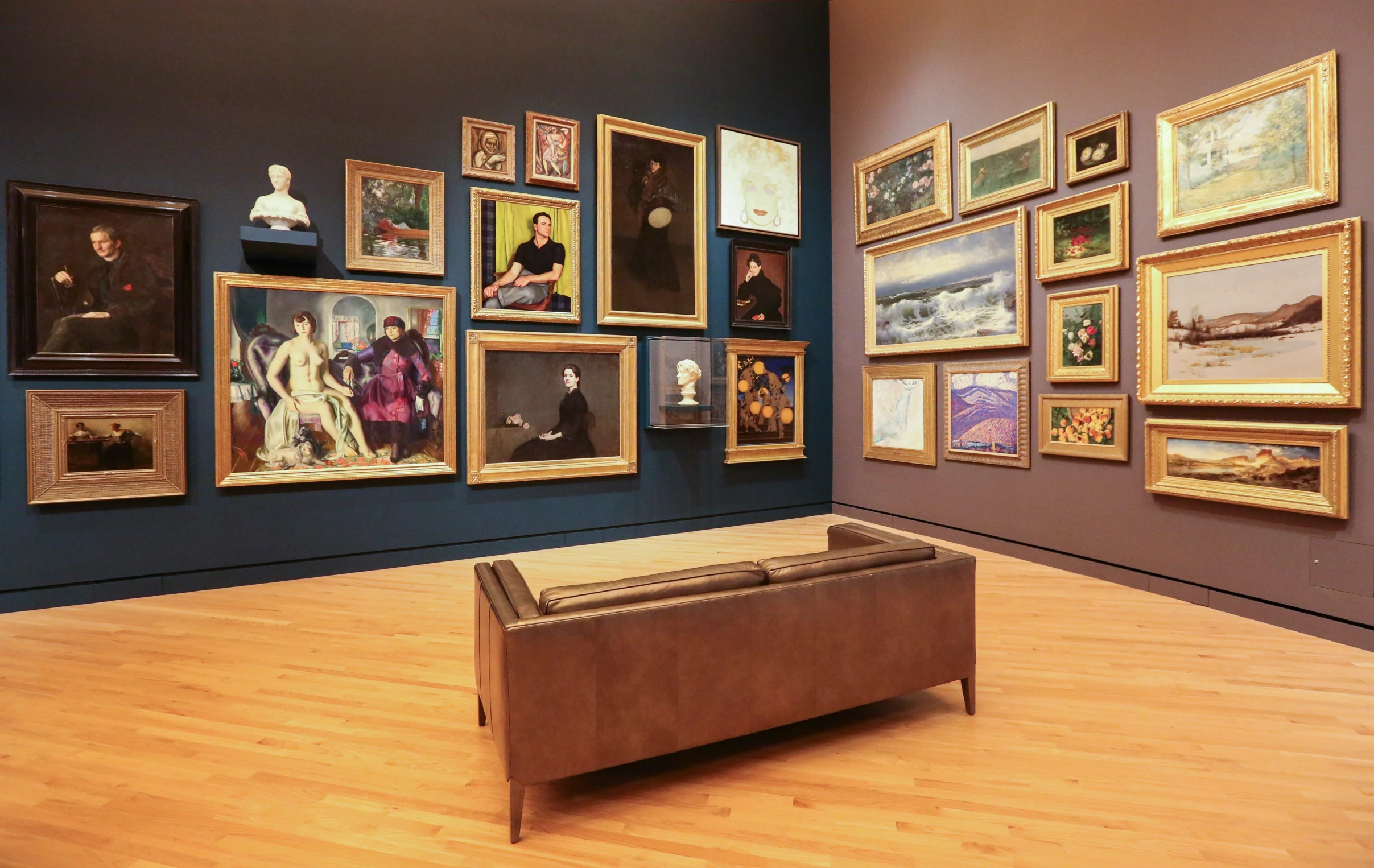a bench sits in the middle of a gallery filled with pictures