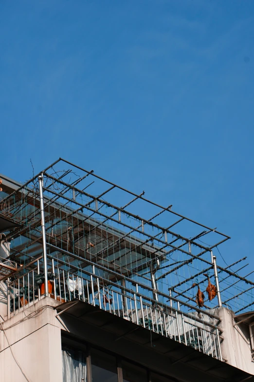 some kind of structure is seen atop the roof